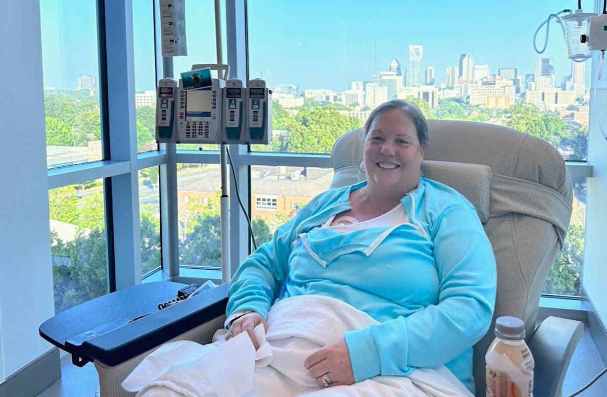 Ellyn Fulton sits in a comfortable chair with an IV in her arm to receive a chemotherapy infusion treatment.