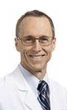 Jeff Hardin wears a white coat and smiles.