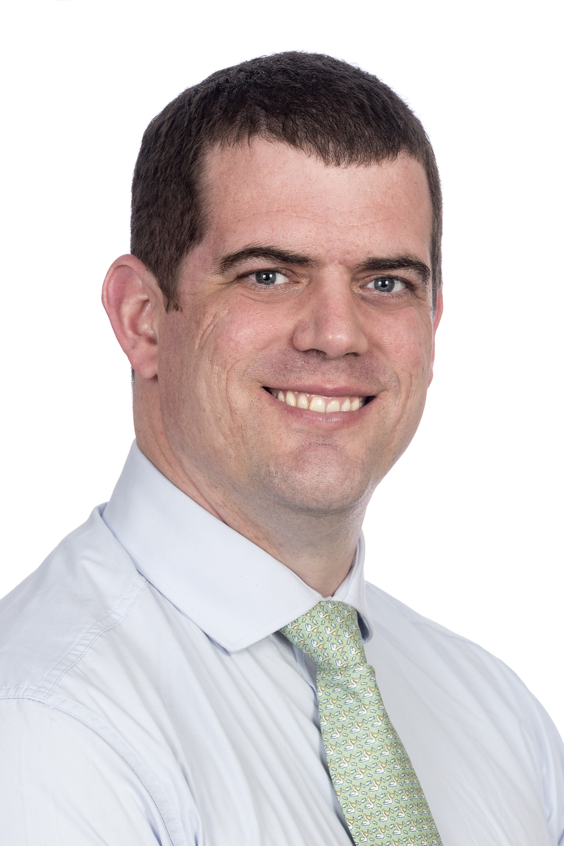 Dr. Scott Nimmons is smiling into the camera.