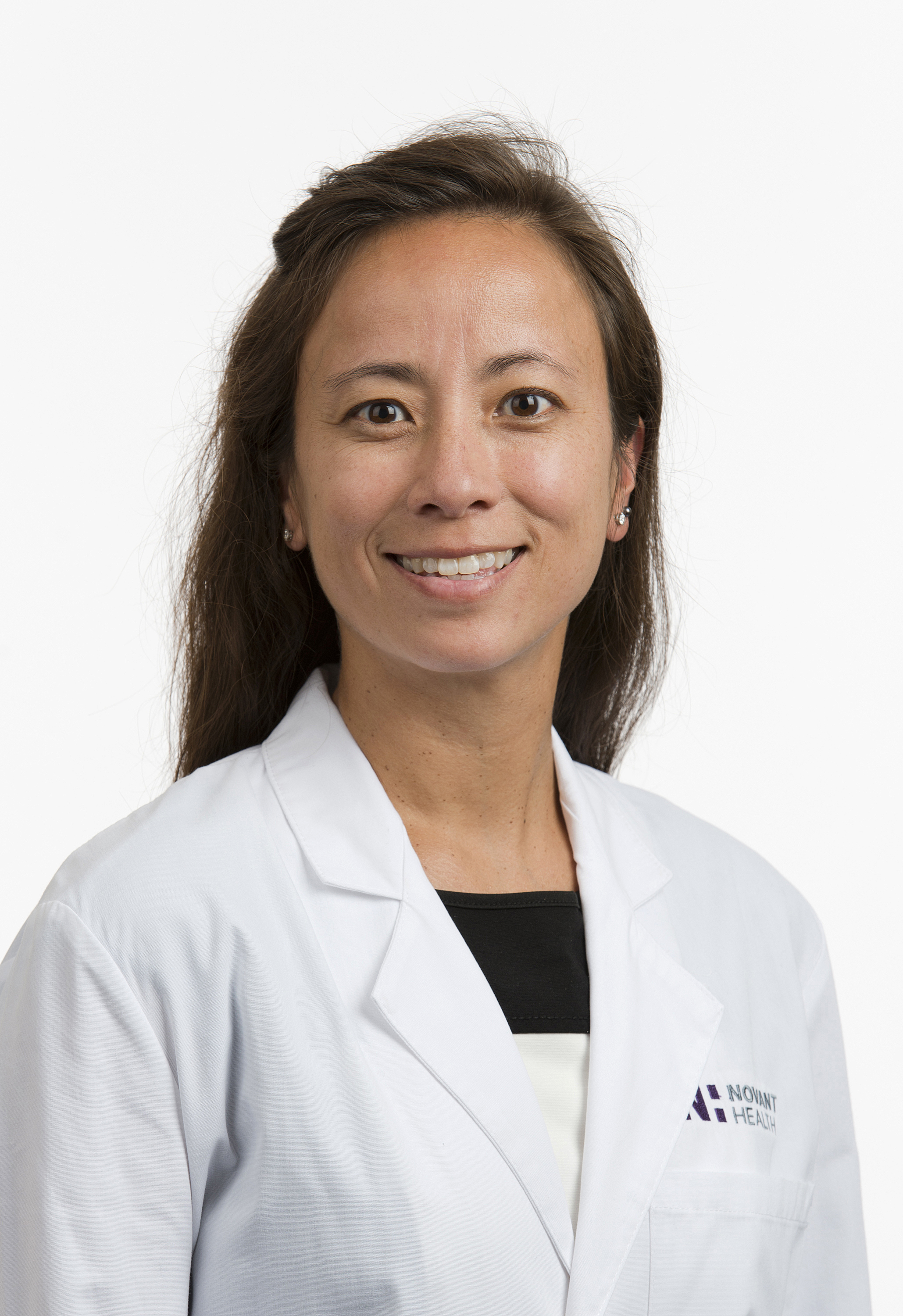 Dr. Elizabeth Skinner wears a white coat and smiles