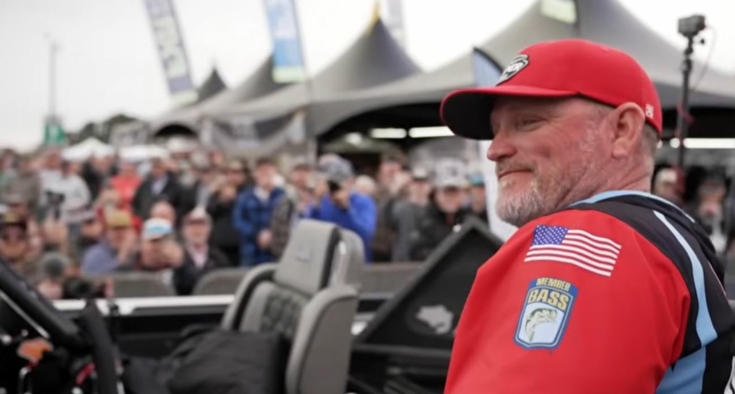 Hank Cherry, a Novant Health patient, looks out over the crowd after winning the Bassmaster Elite Series tournament, a fishing tournament in Guntersville, Alabama.