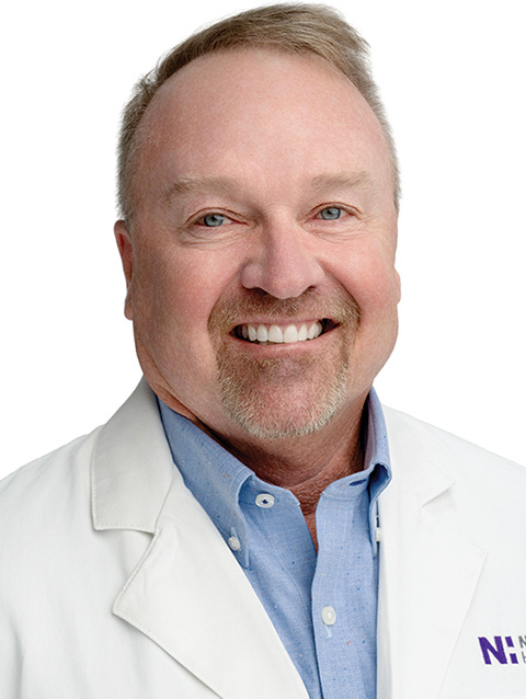 Dr. Donald Yakel wears a white coat and smiles.