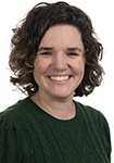 Dr. Jordynn Fraser wears a black shirt and smiles.