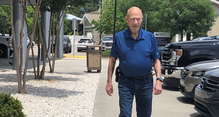 Marshall Evans walks in front of the Novant Health heart and vascular clinic.