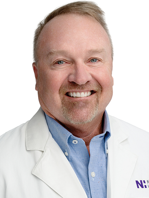 Dr. Donald Yakel wears a white coat and smiles.