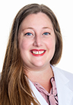 Dr. Rebecca Pratt wears a white coat and smiles.
