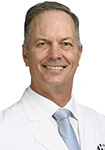 Dr. Mike Kissenberth wears a white coat and smiles.