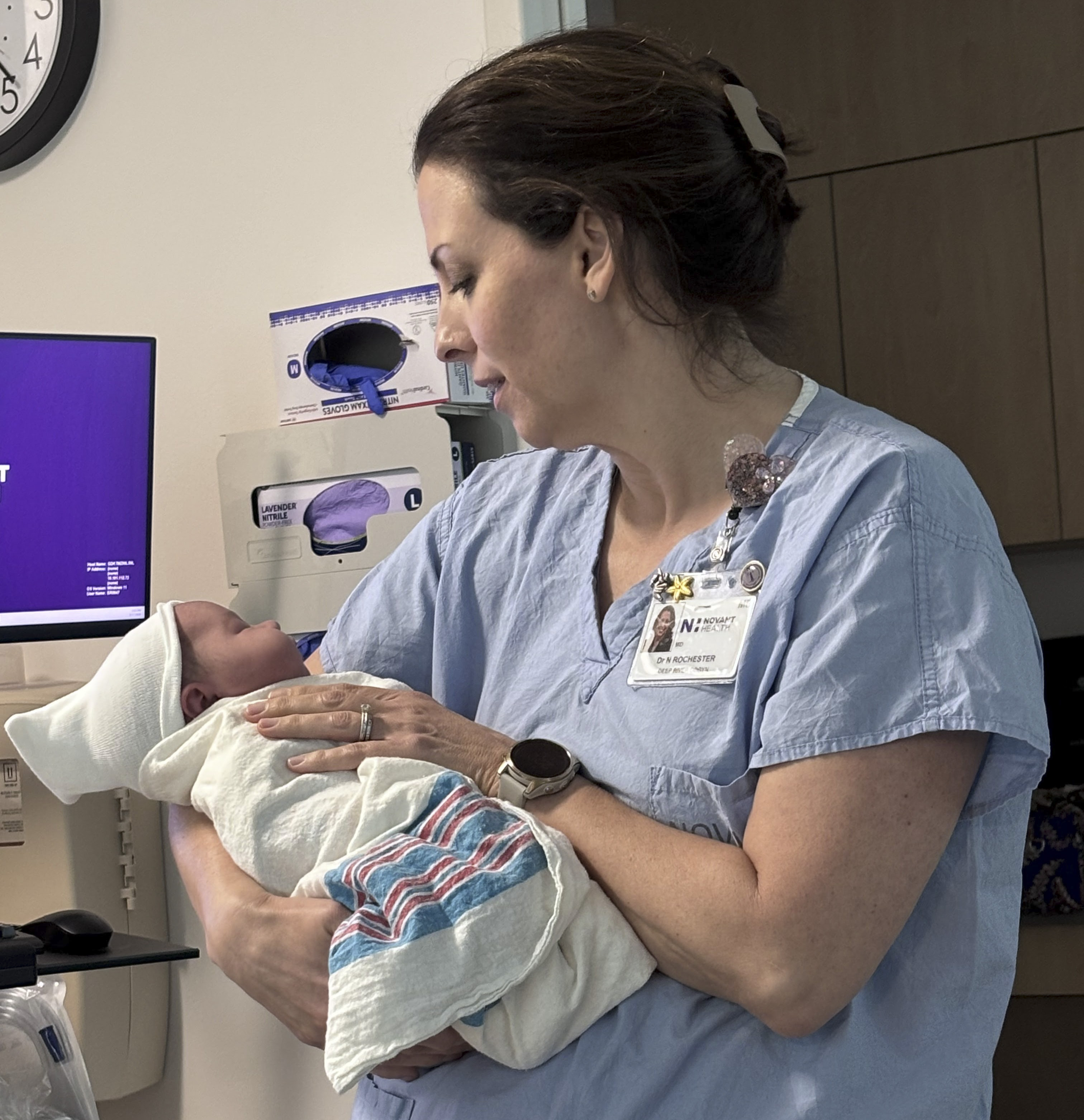 Dr. Natalie Rochester holds baby Carter Miller.