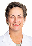 Dr. Sarah Fox wears a white coat and smiles.