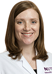Dr. Meredith Snapp wears a white coat and smiles.