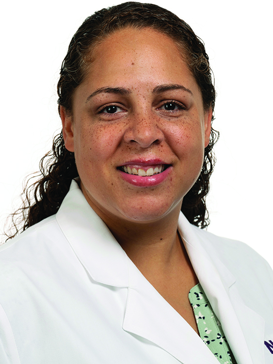 Amanda Colon wears white coat and smiles.