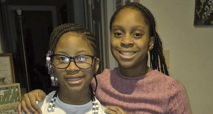 Sisters Kelly and Kyla stand side-by-side.