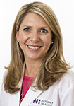 Dr. Rina Roginsky wears a white coat and smiles.