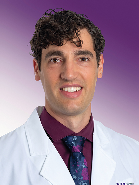 Dr. Austin Morgan wears a white coat and smiles.