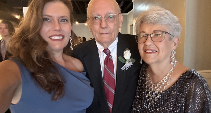 Christine, Bob and Joan Eyster are wearing formal wear and smiling.