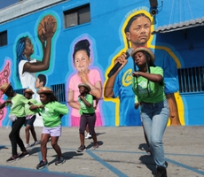 How Nipsey Hussle Inspired Blue Shield, Artist Moses Ball and Others To Create a Mural In South LA