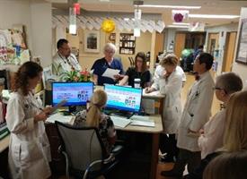 palliative care team huddles on the palliative care inpatient unit at Strong Memorial Hospital