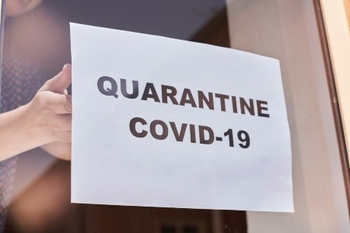 nursing home COVID quarantine sign on door