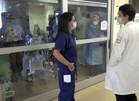 A UR Medicine team cares for a patient with COVID-19 in the ICU. 