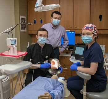 Dr. Ren mentors two residents during his scientific studies