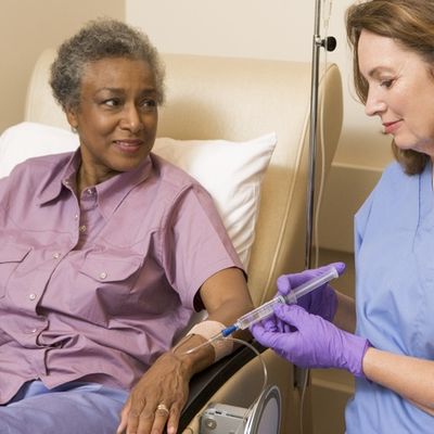 Black female patient with white female nurse getting an infusion