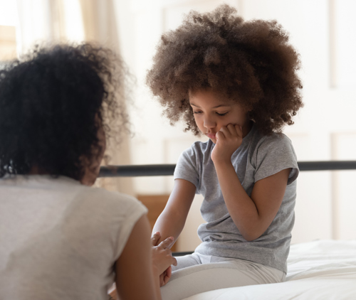 mother comforts child having mouth pain