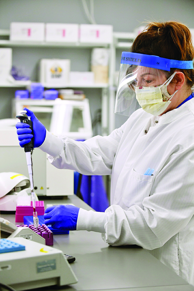 A lab researcher participates in one of many COVID-related studies.