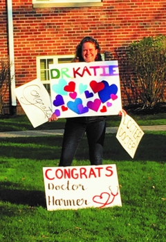 Dr. Katie Harmer celebrates earning her medical degree from the University of Rochester School of Medicine and Dentistry.