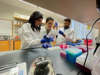 Maryam with two residents in lab