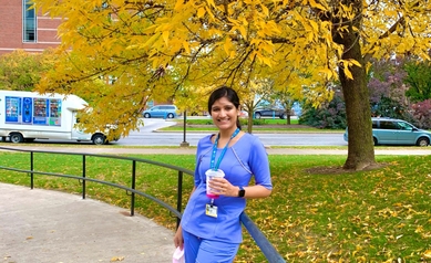 Dr. Thakkar standing outside Eastman Institute 