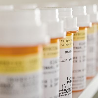 Medicine Bottles Arranged In Shelf
