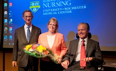 Kathy Rideout with UR president Joel Seligman and CEO Brad Berk
