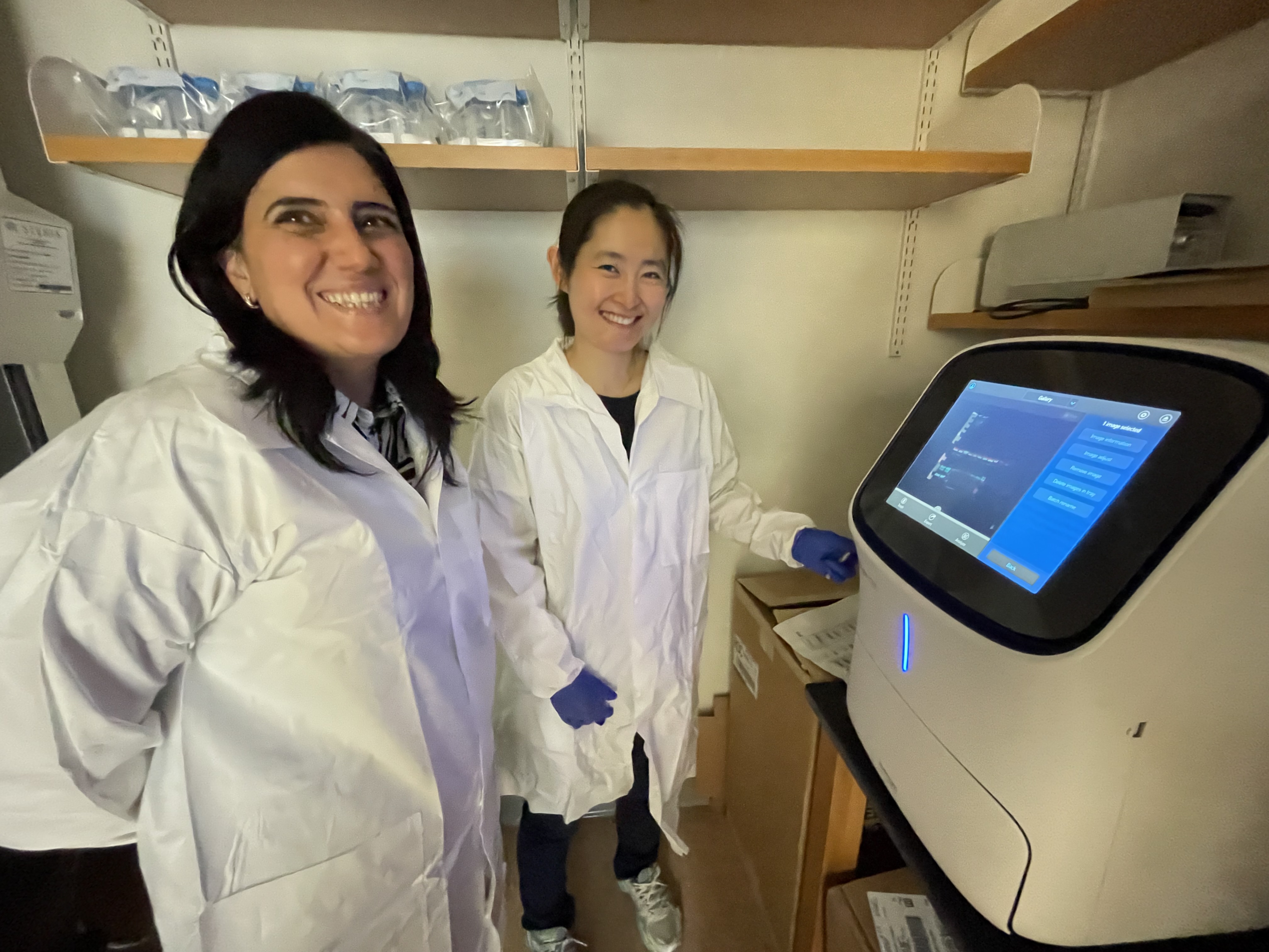 Drs Karayanni and Wang standing in the lab 