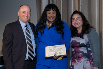 Dr. Wong standing with Dr. McLaren and Pediatric Dentistry graduate 