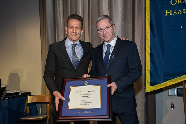 Dr. Ghanem receiving award from Dr. Eliav