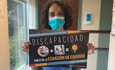 Paola Moreno holding a sign a