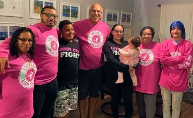 Perez-Delgado family poses wearing shirts that say "stronger than cancer" or "join our fight."