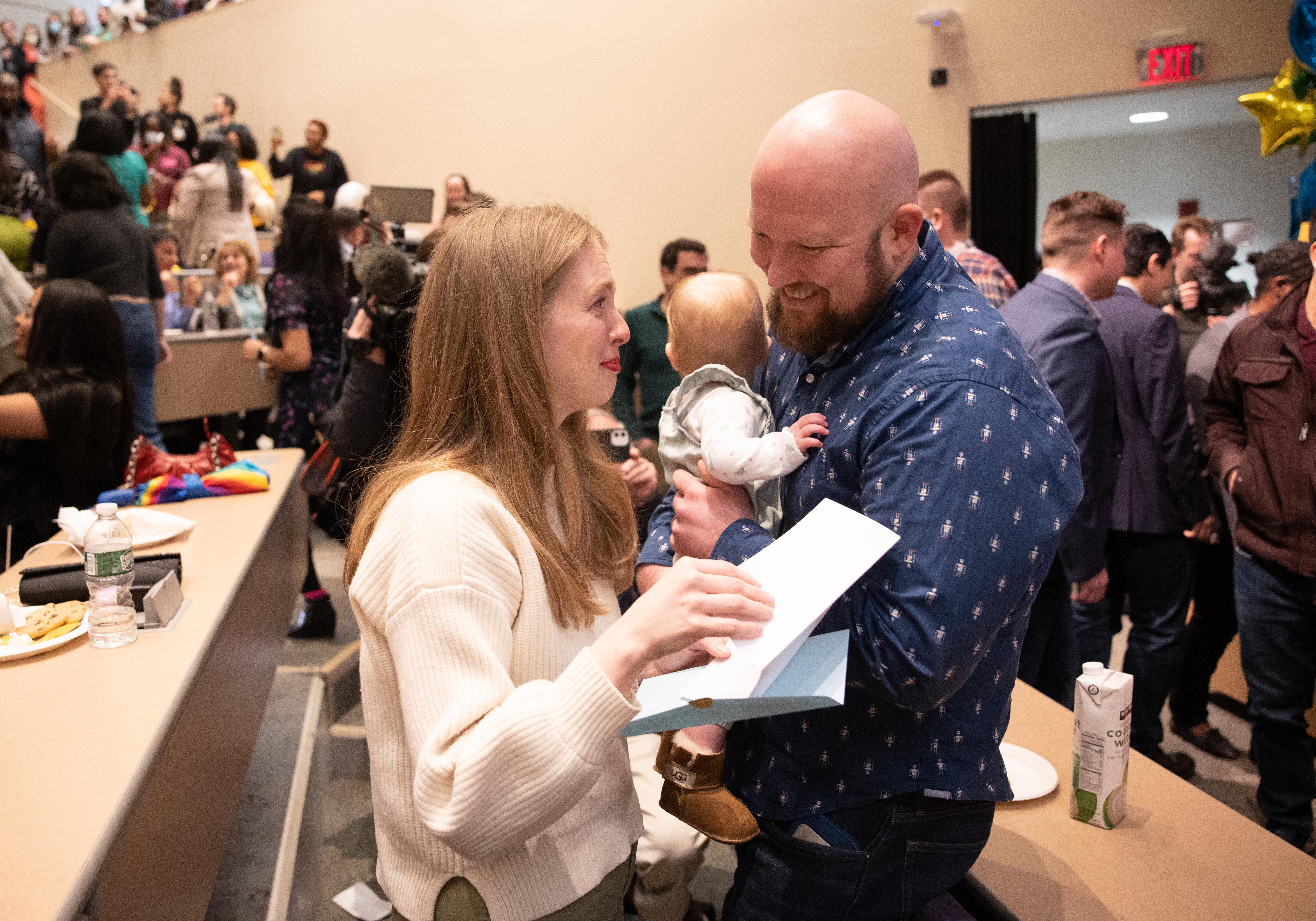 Clare Lennon matched with UR OBGYN, reads her match letter w/ husband Jeffrey Baird. // University of Rochester School of Medicine and Dentistry students find out where their residencies will be on Match Day at the URMC March 17, 2023. // photo by Keith Walters / University of Rochester
