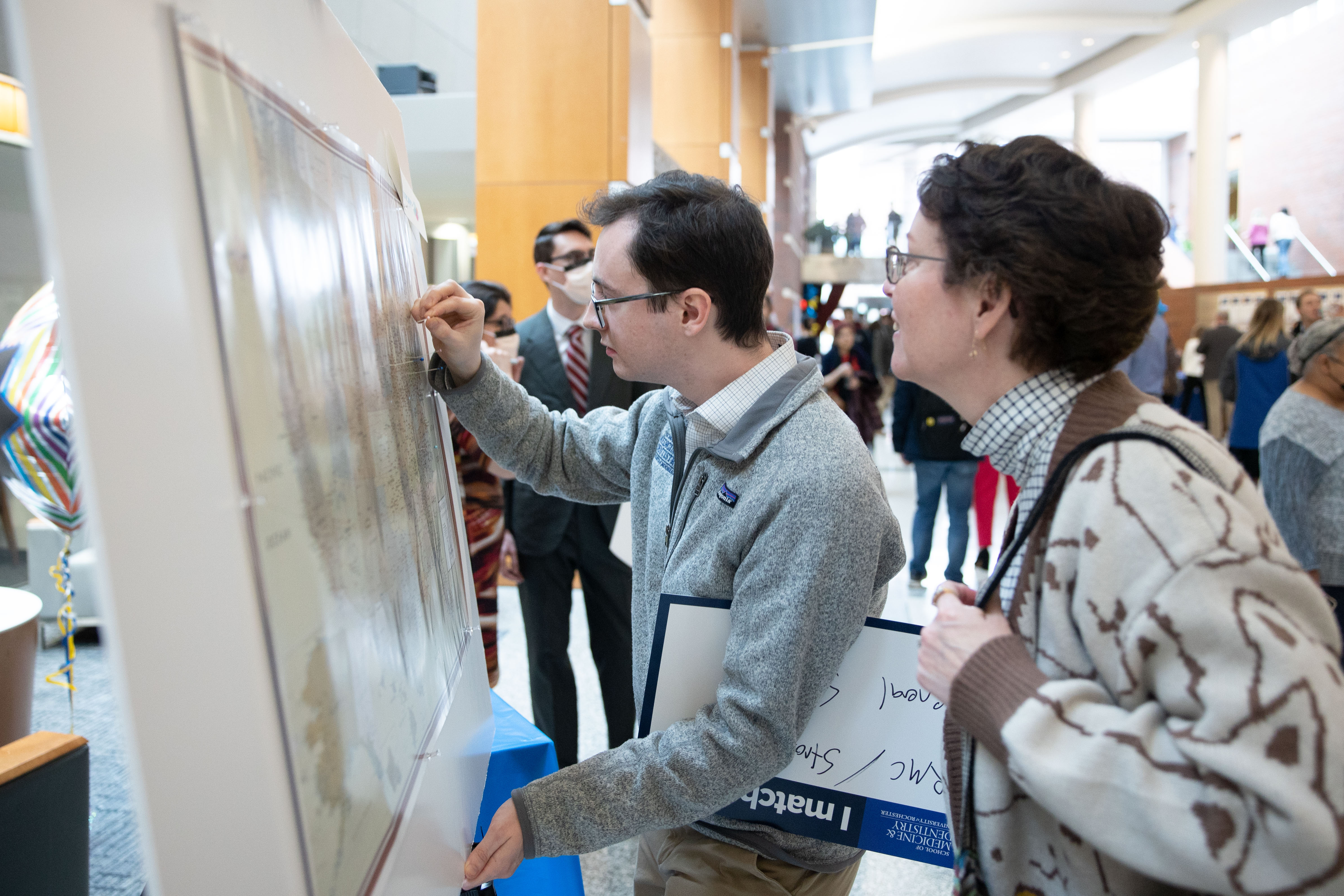 Michael McCabe, URMC, General Surgery, pins his residency location onto a map.