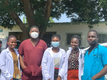 Mark Osabutey as a medical officer (general physician) stands with physician assistant trainees on his clinical team after ward rounds at the University Hospital, Kwame Nkrumah University of Science and Technology, Ghana.