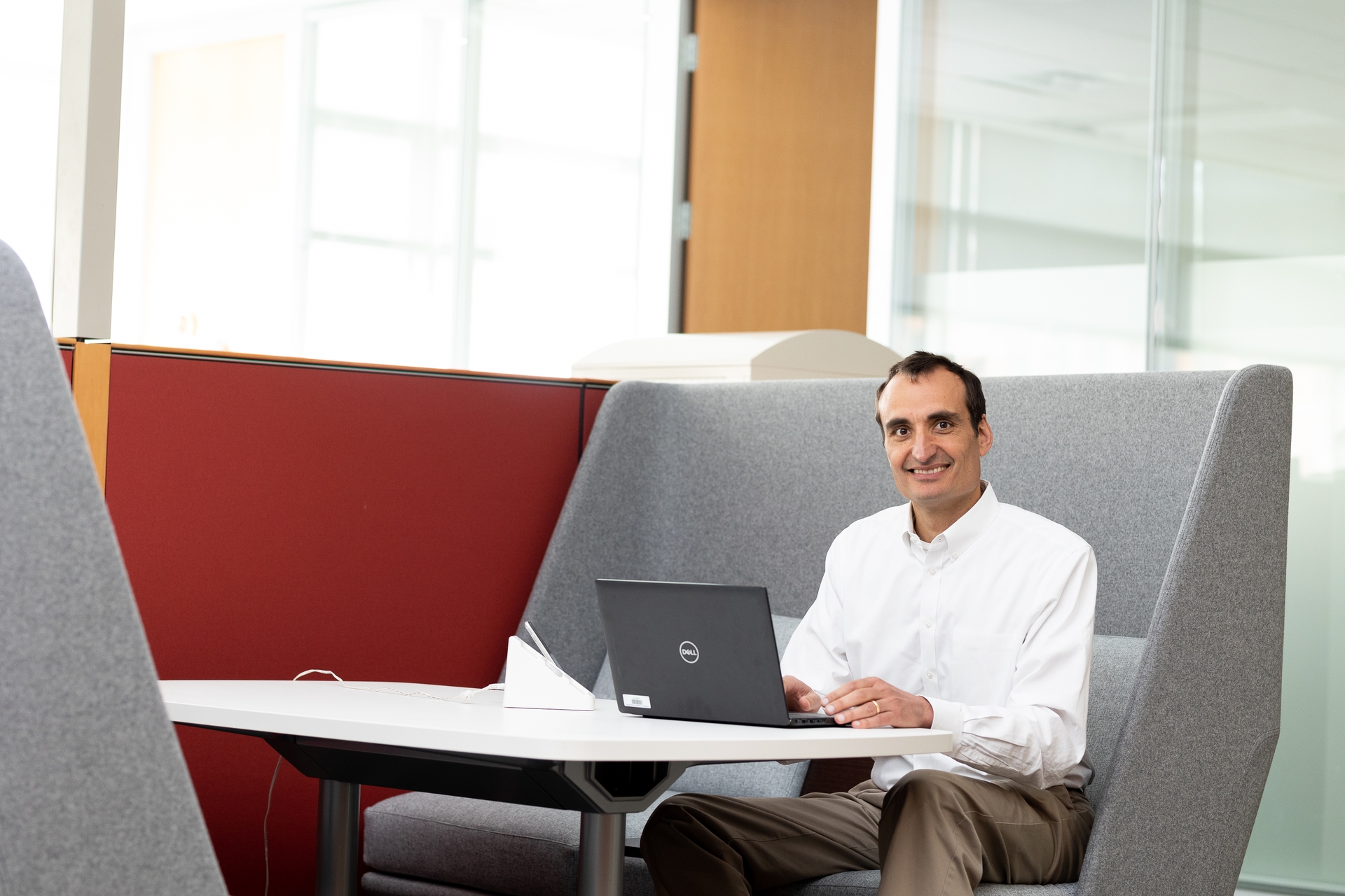 Ray Dorsey, MD, PhD, works at a table in the Center for Health + Technology at the University of Rochester Medical Center.