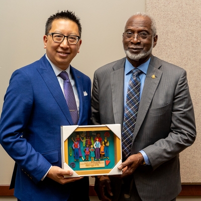 Michael Mendoza, MD, MPH poses with his award with David Satcher, MD, PhD