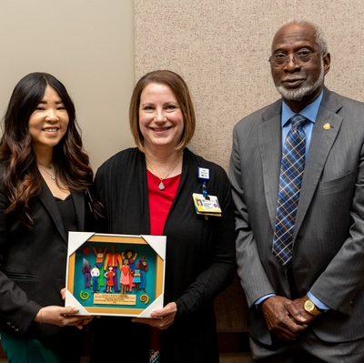 Wendy Hou, DNP, RN, and Christine Maness, MS, RN, pose with David Satcher, MD, PhD.