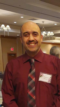 smiling Almirza at camera