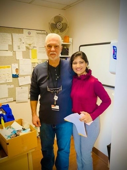 Dr. DeRosa and Dr. Thakkar standing, looking at camera