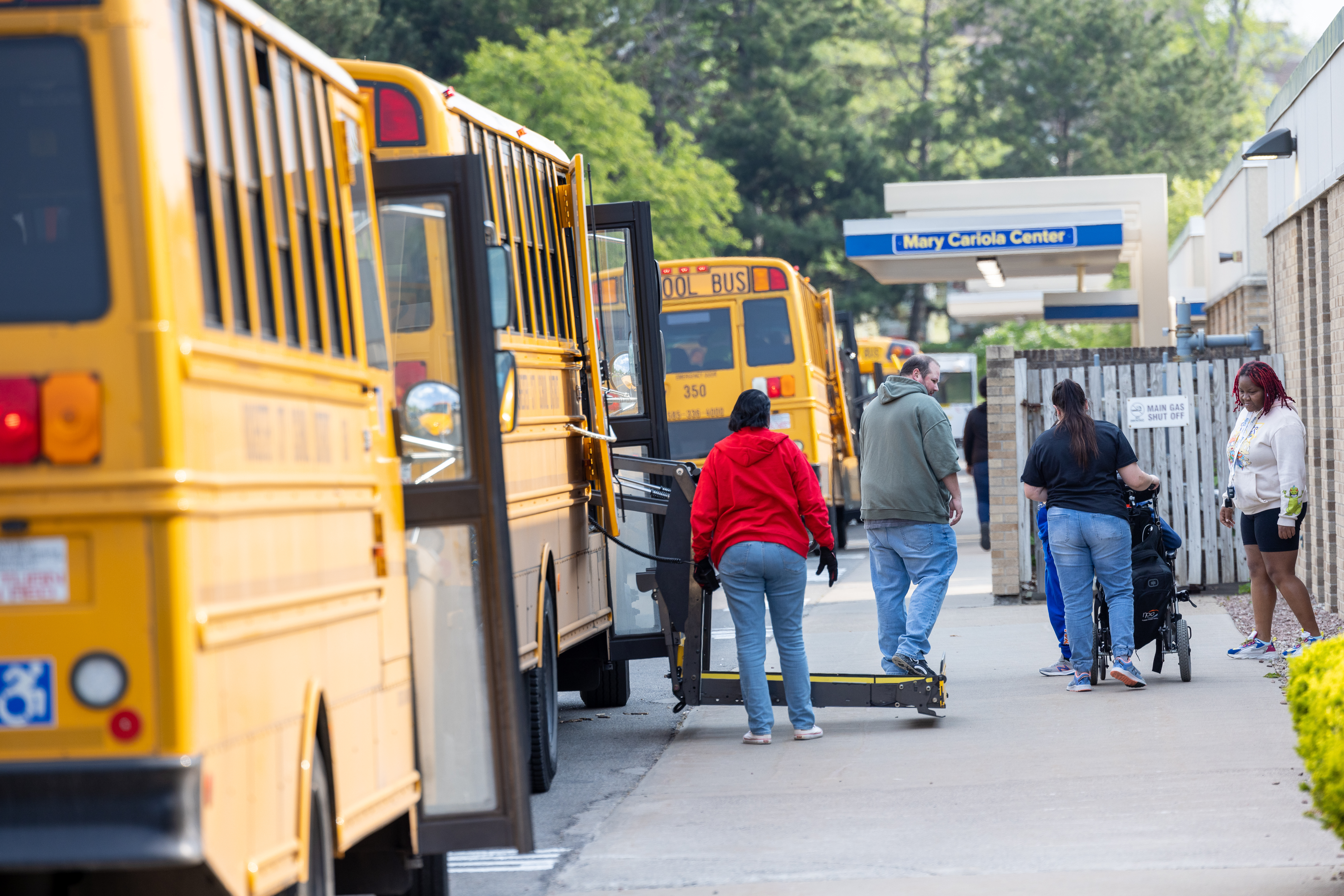 Buses are lined up outside of the Mary Cariola Center, the staff is helping students arrive for the school day.