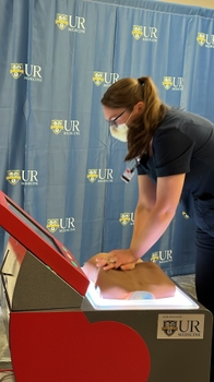 A nurse uses a new CPR training station. 