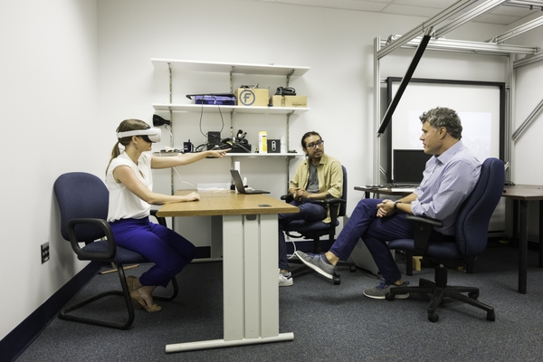 Jose Reynoso and NEUROCITY mentor Duje Tadin, PhD, with virtual reality research subject.