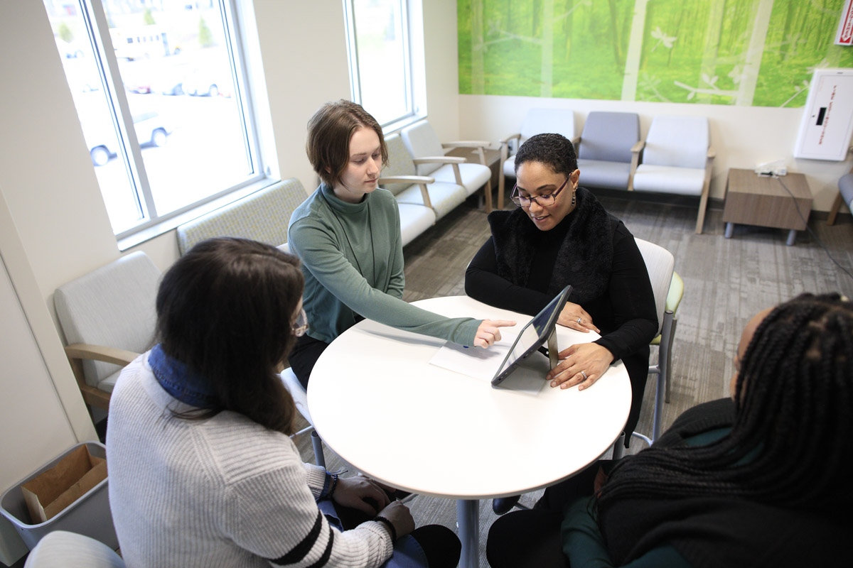 From left Rachel Missell-Gray Jenson Rowan Arielle Sheftall and Dakota Daniels work on the peer-support app for teens.