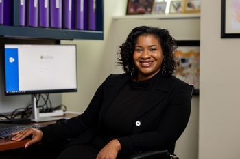 Edith Williams, MS, PhD (photo credit: John Schlia) Edith Williams, MS, PhD, seated at a desk
